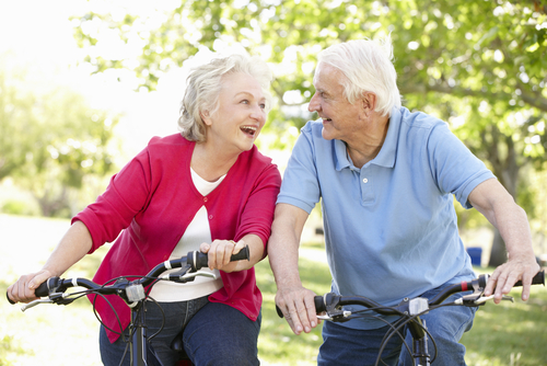 elderly couple riding the bike